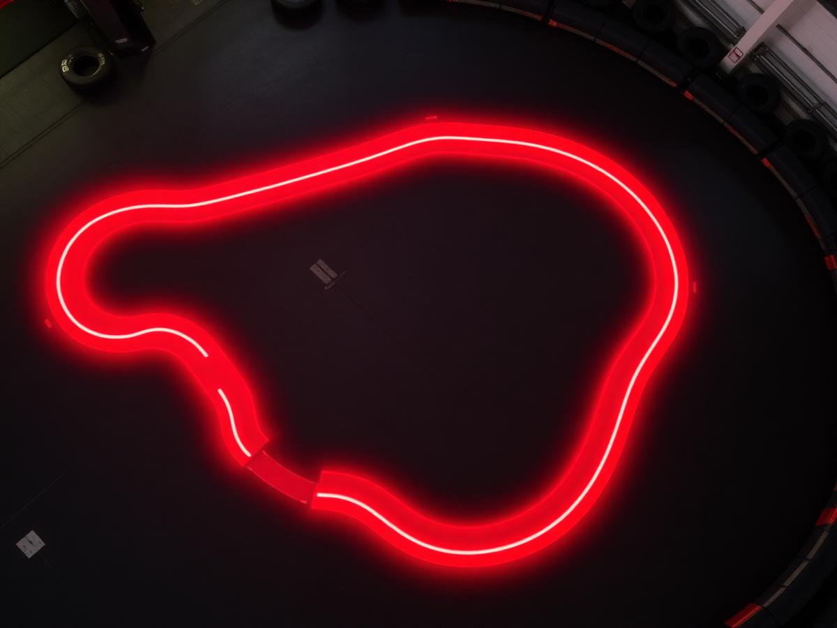 Overhead view of the illuminated Apex Karting circuit layout